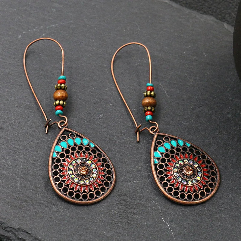 Vintage Palace Style Dangle Earrings for Women Boho Ethnic Creative Hollow Leaf Round Sun Hand Water Drop Earring Female Jewelry 1267