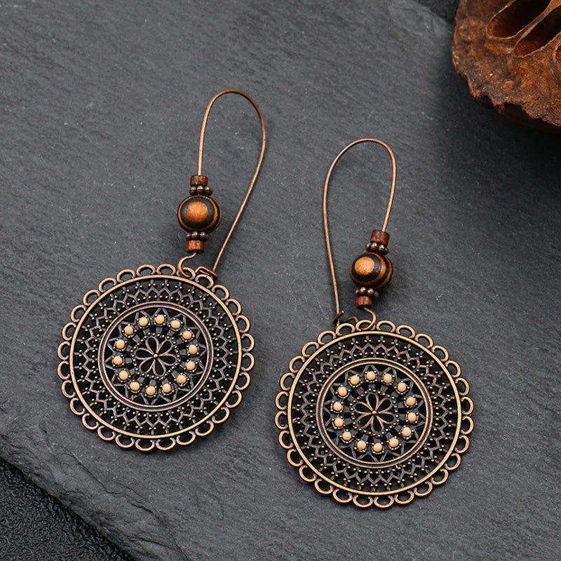 Vintage Palace Style Dangle Earrings for Women Boho Ethnic Creative Hollow Leaf Round Sun Hand Water Drop Earring Female Jewelry 1526